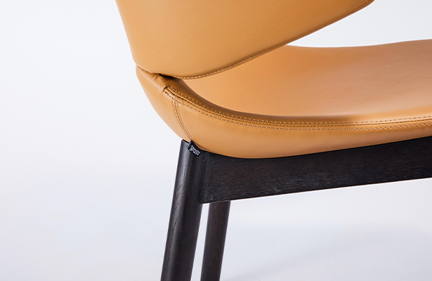 Hug Dining Chair With Arm - Tan Pu Leather / Black - Sit Back and Relax